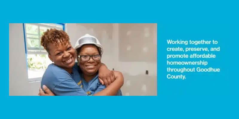 Working together to create, preserve and promote affordable housing throughout Goodhue County - with a mom and child hugging on the worksite