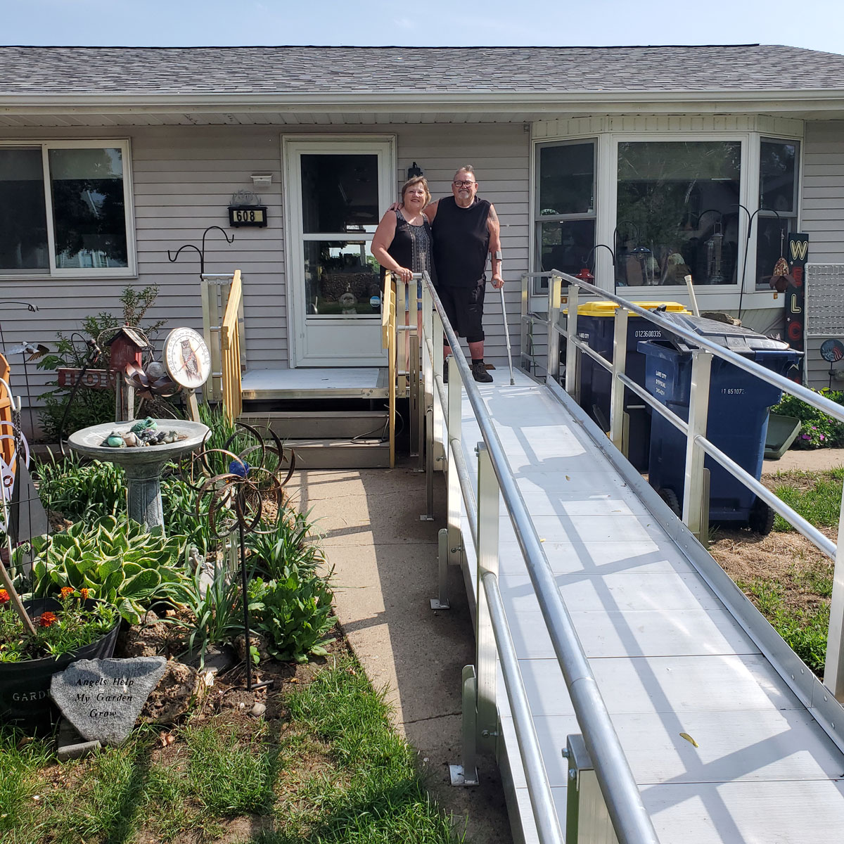 Home owners standing by ramp on a home revitalization project.