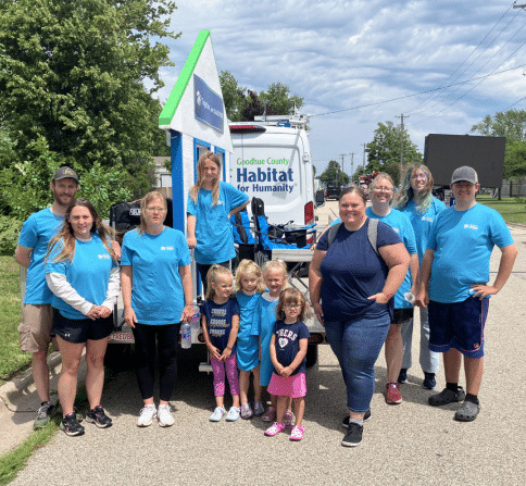 Habitat Float wih volunteers and staff in front.