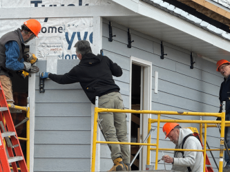 Group of volunteers working on a Habitat build.
