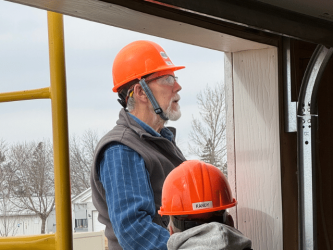 Lou Behrens, a Habitat for Humanity volunteer at the build site.