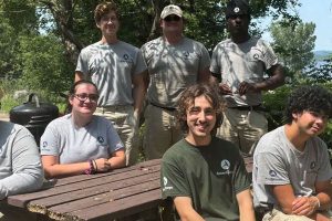 AmeriCorps Maple 6 Volunteer Team sitting at a picnic table