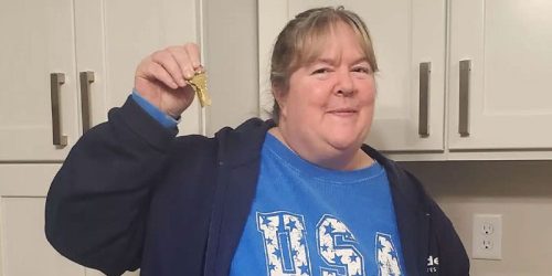 Homeowner Denise with the keys to her home