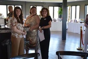 Three attendees at the beginning of Spring Has Sprung fundraiser